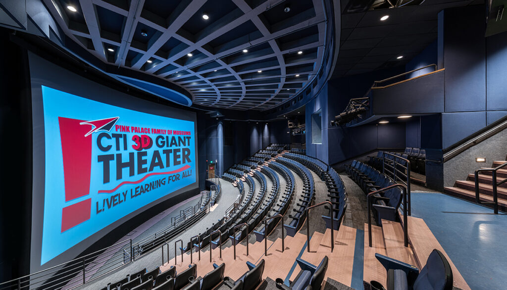 Interior of a modern 3d theater in Memphis with rows of blue seats and a large screen displaying a promotional image for lively learning.