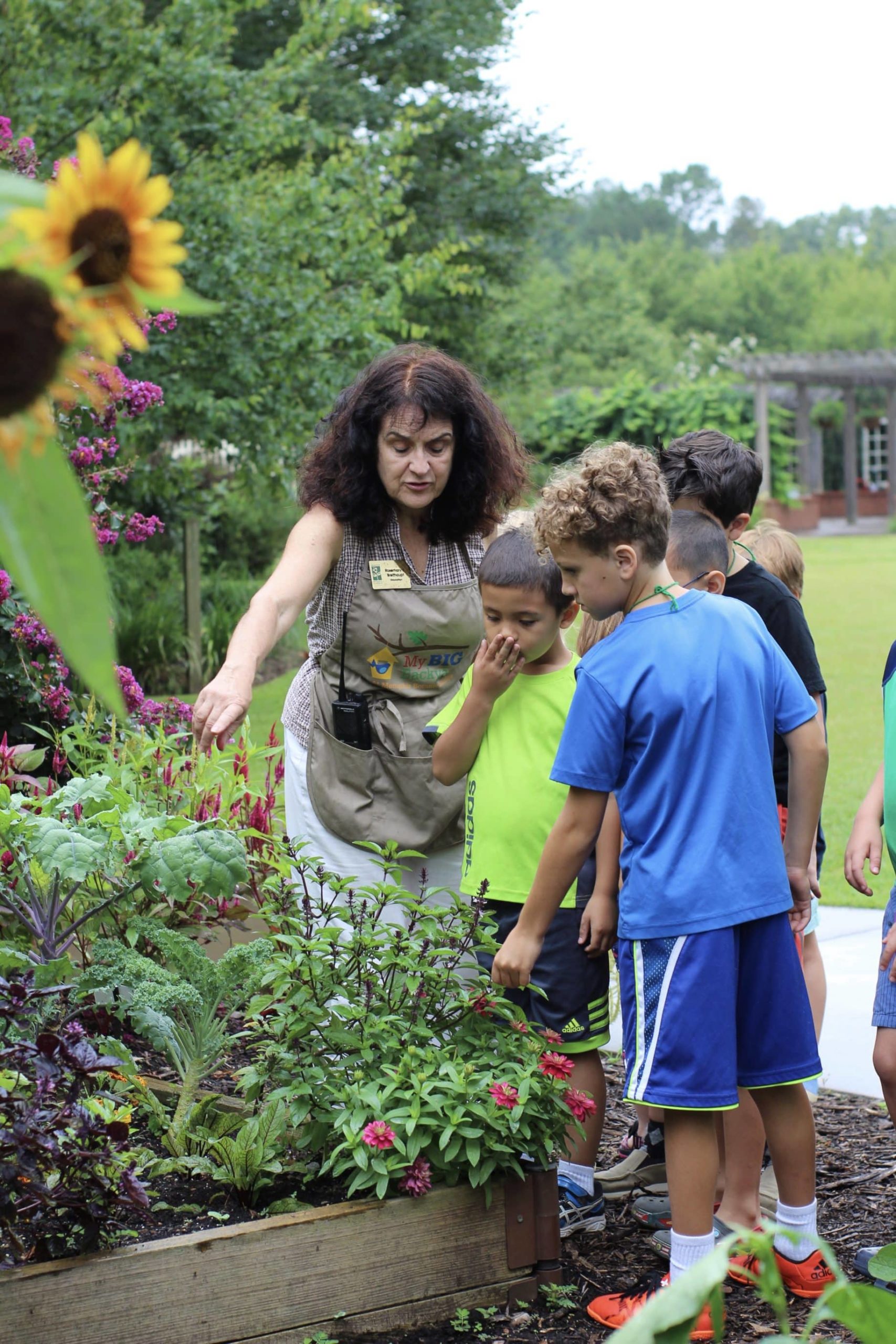 Botanist with children at Memphis Botanic Garden