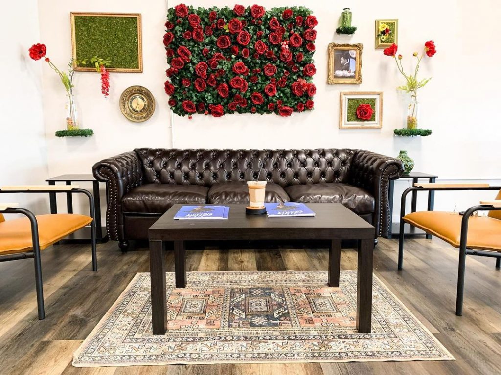 A cozy living room with a leather couch, coffee table, and flowers - perfect for hunkering down in Memphis.