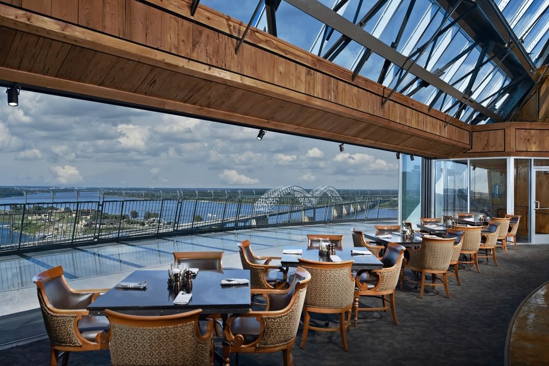 A rooftop restaurant with a view of the ocean.