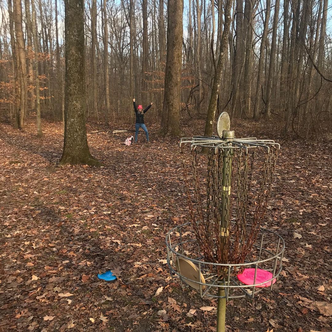 People playing at a disc golf course in Memphis at Meeman Shelby Forest National Park.