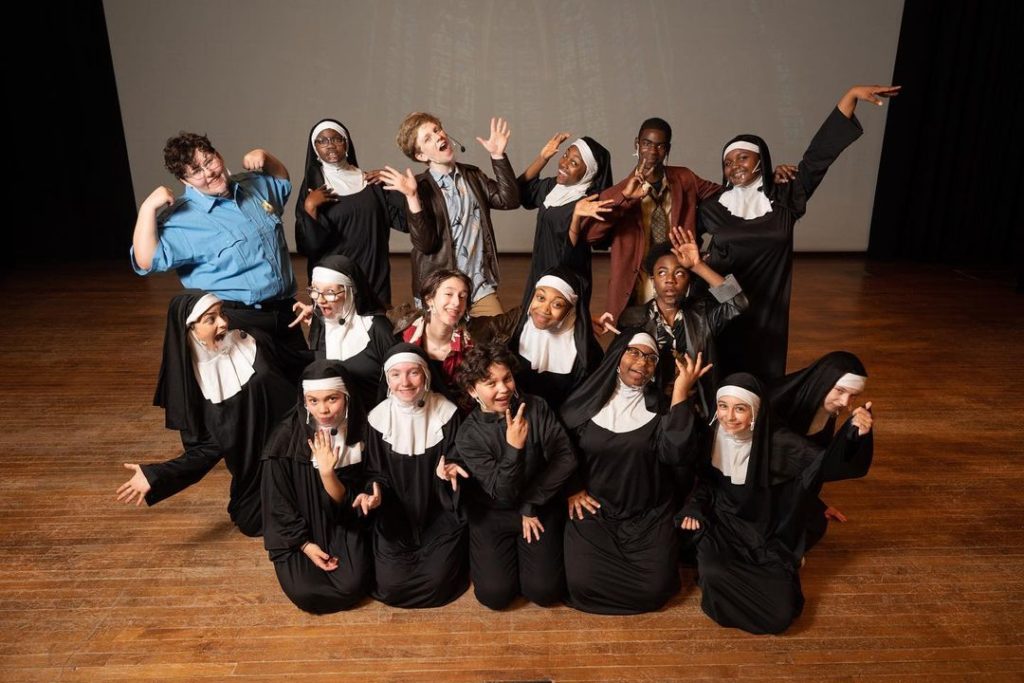 A group of nuns posing for a photo.