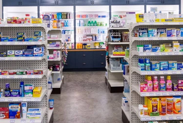 A pharmacy with shelves full of different types of medicine.