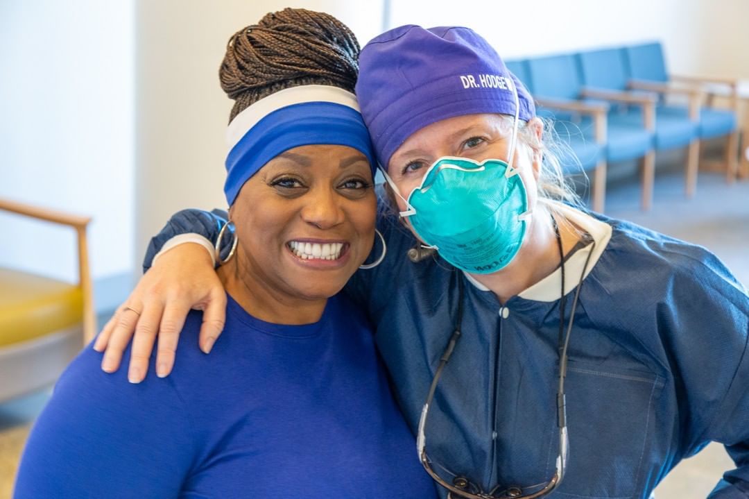 Two women from Memphis Teacher Residency program wearing surgical masks posing for a photo.