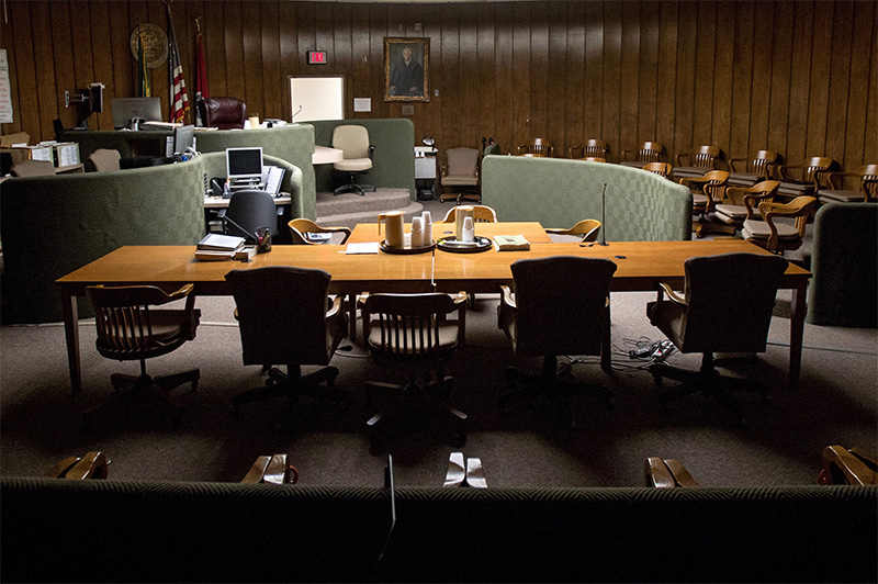 A courtroom serving Memphis with a large table and chairs.