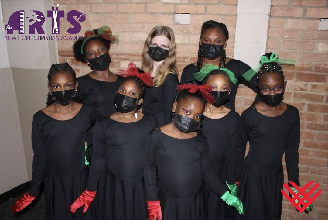 A group of girls wearing black dresses on Giving Tuesday.
