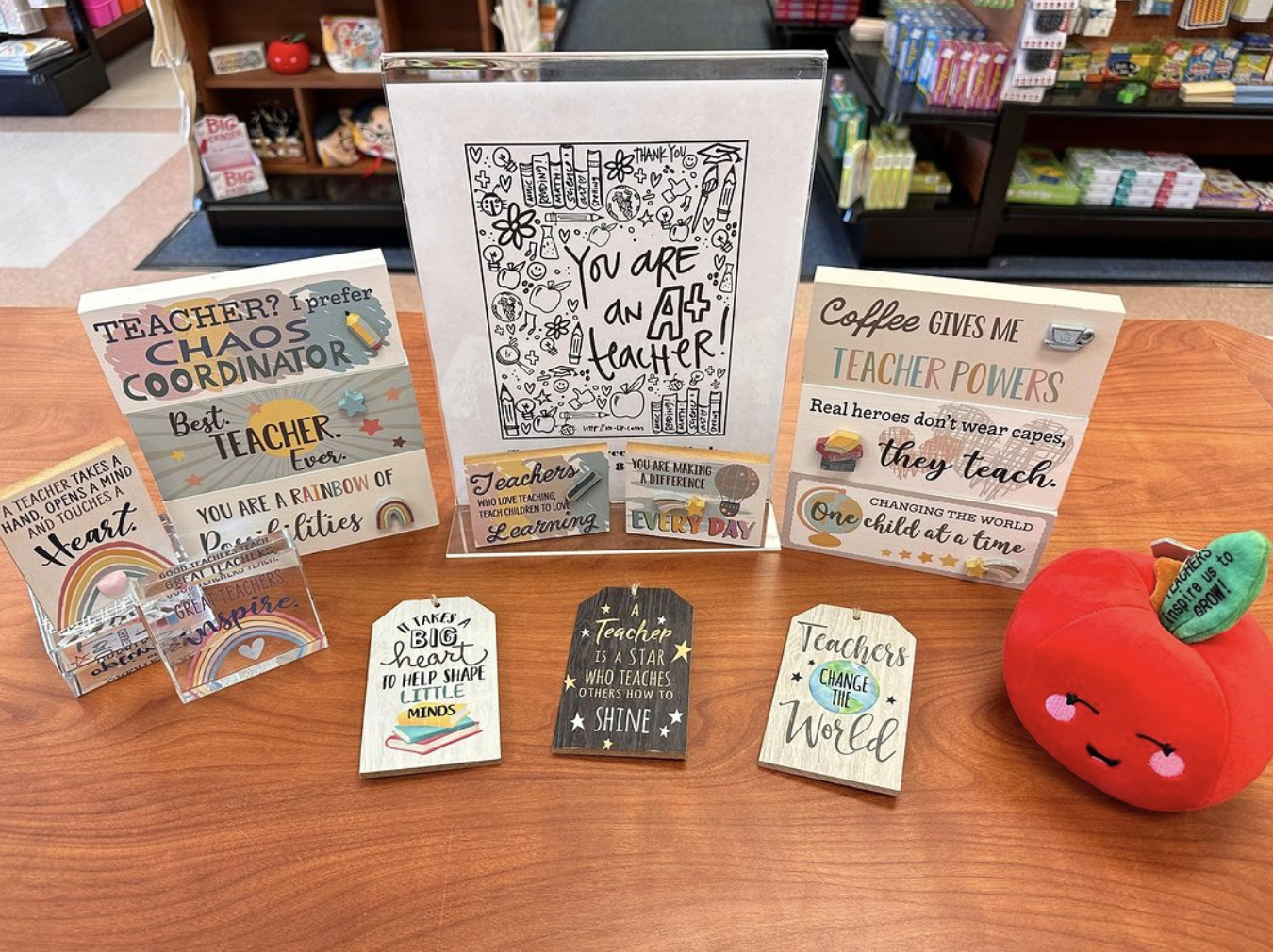 A selection of coloring books and other items on a table for teacher appreciation.