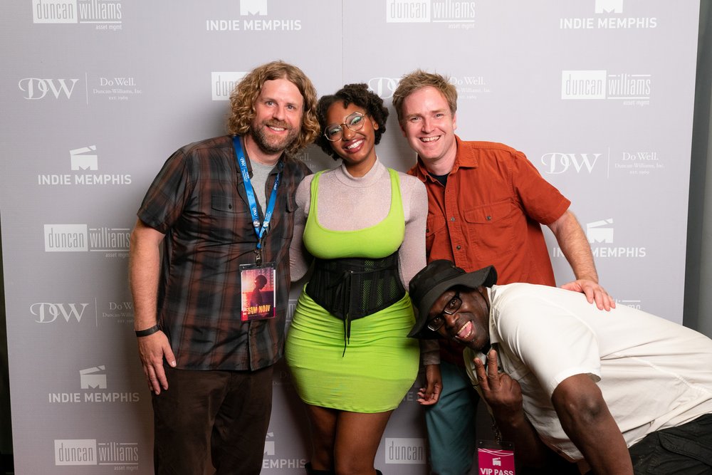 A group of people posing for a photo at the Indie Memphis event, reigniting the local film scene.