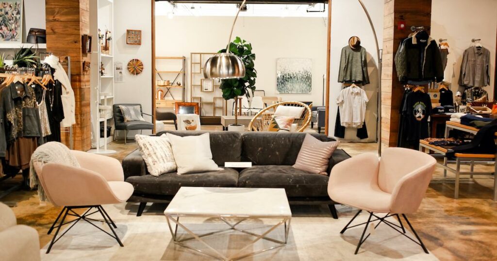 Experience the festive finds of a clothing store during the holiday season, complete with cozy couches and chairs for your comfort.