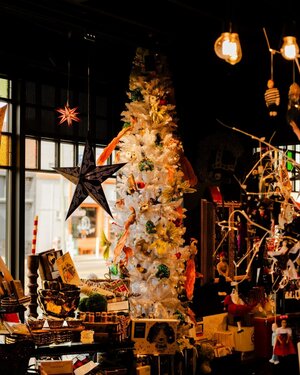 In the midst of the holiday season, a store showcases a festive finds of a Christmas tree adorned with an abundance of decorations.