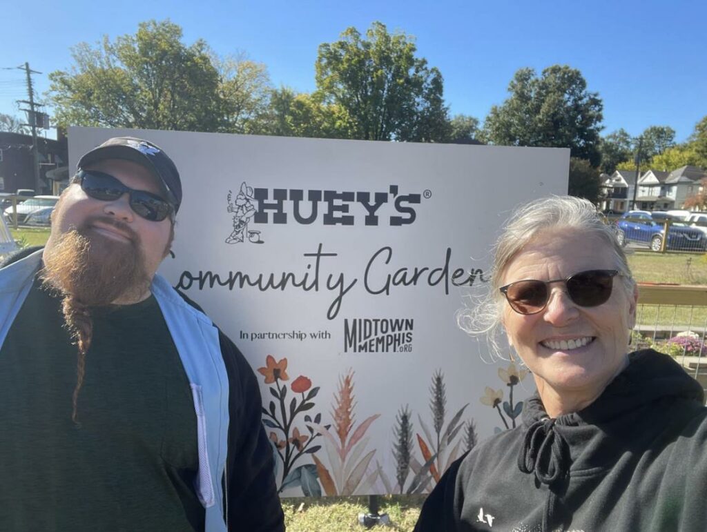 Two people volunteer at Hughes Community Garden.