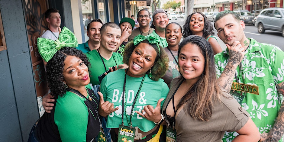 A group of people in green shirts poses for a photo during a St Patrick's Day celebration in Memphis.