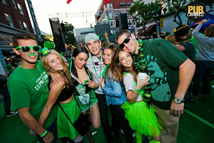 A group of people posing for a photo at a St. Patrick's Day party in Memphis.