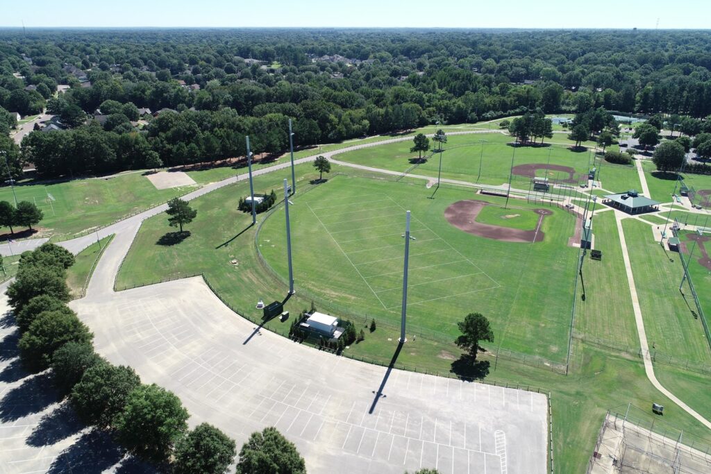 Aerial view of a Memphis park with baseball fields, walking paths, green areas, and a parking lot.